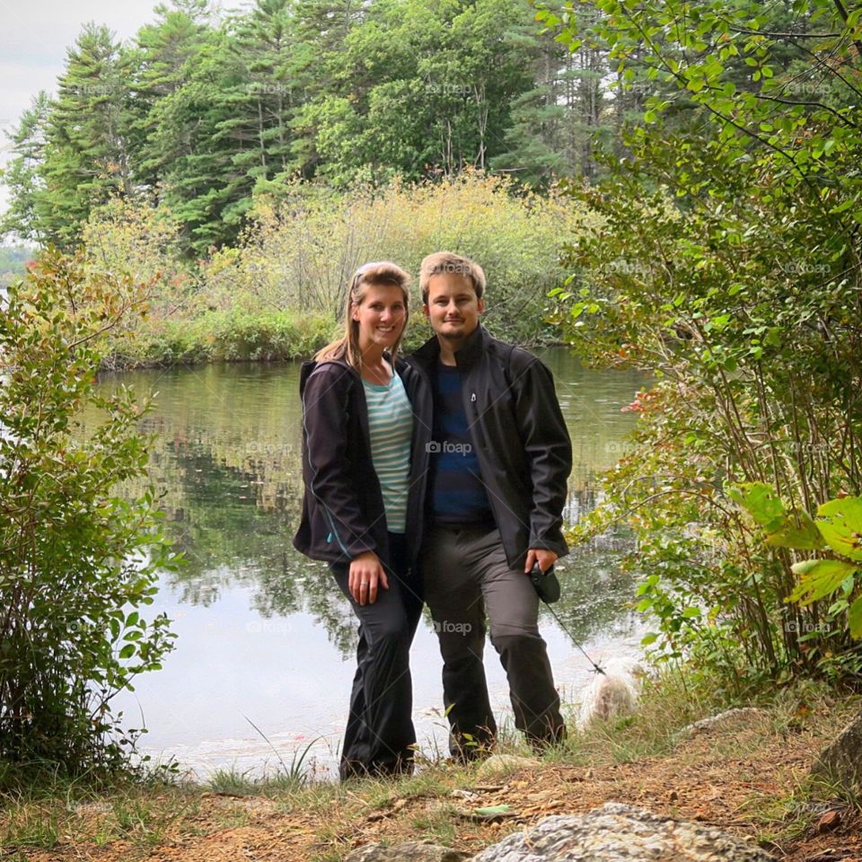 Couple hiking by water 