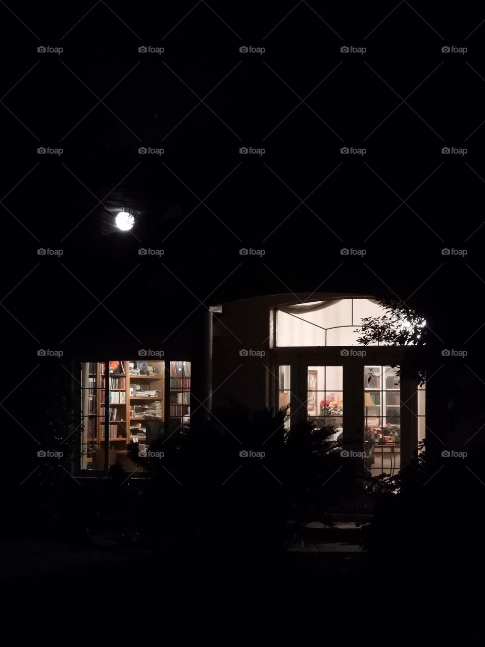 Just windows and the moon against the darkness outside
