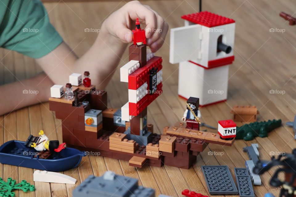 Child playing Lego pirates