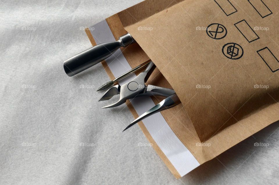 Manicure tools in a kraft bag for sterilization