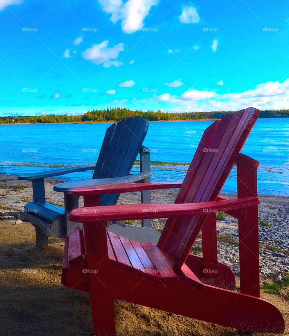 Adirondack chairs on beach 