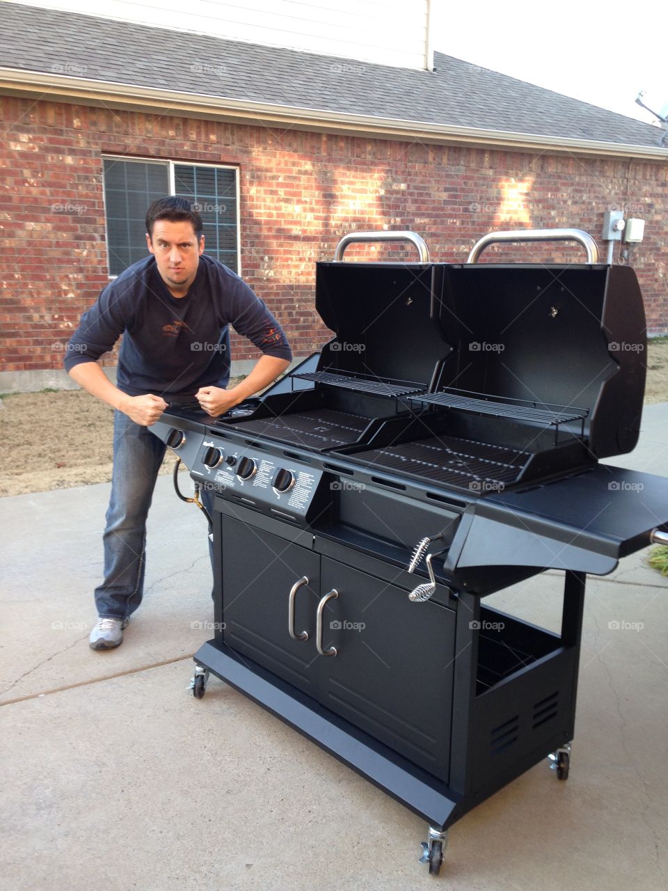 Grilling machine. Man put together his double girl and can't wait to use it