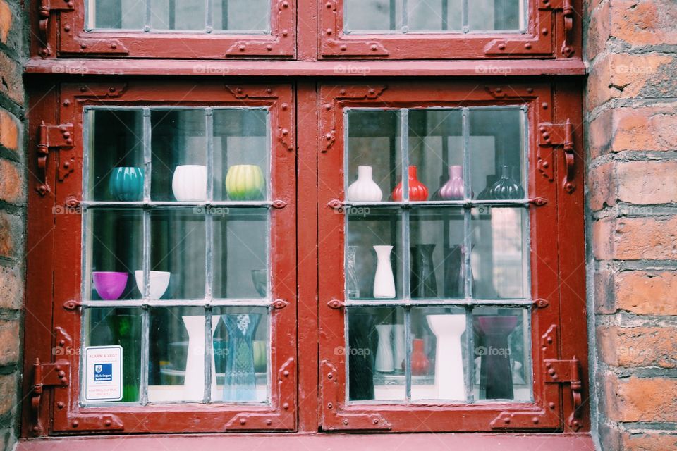 Window display with small vases