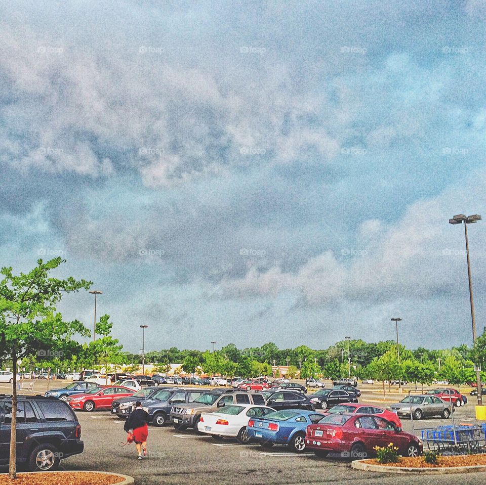 She's racing to her car as the storm rolls in...