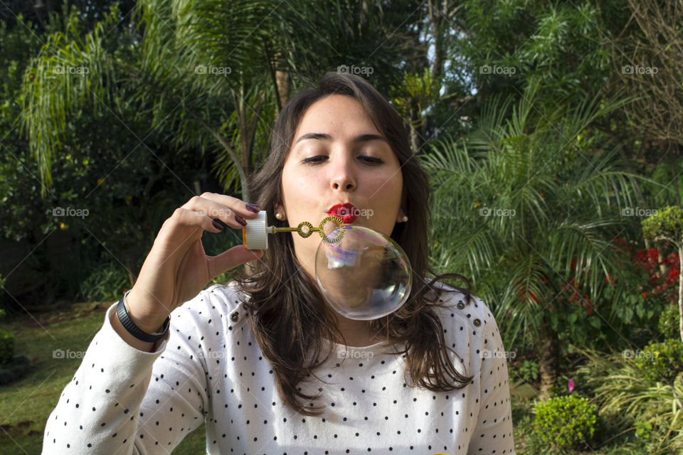 Girl blowing bubbles