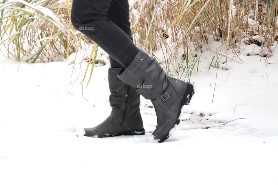 Woman wearing Totes boots in the snow