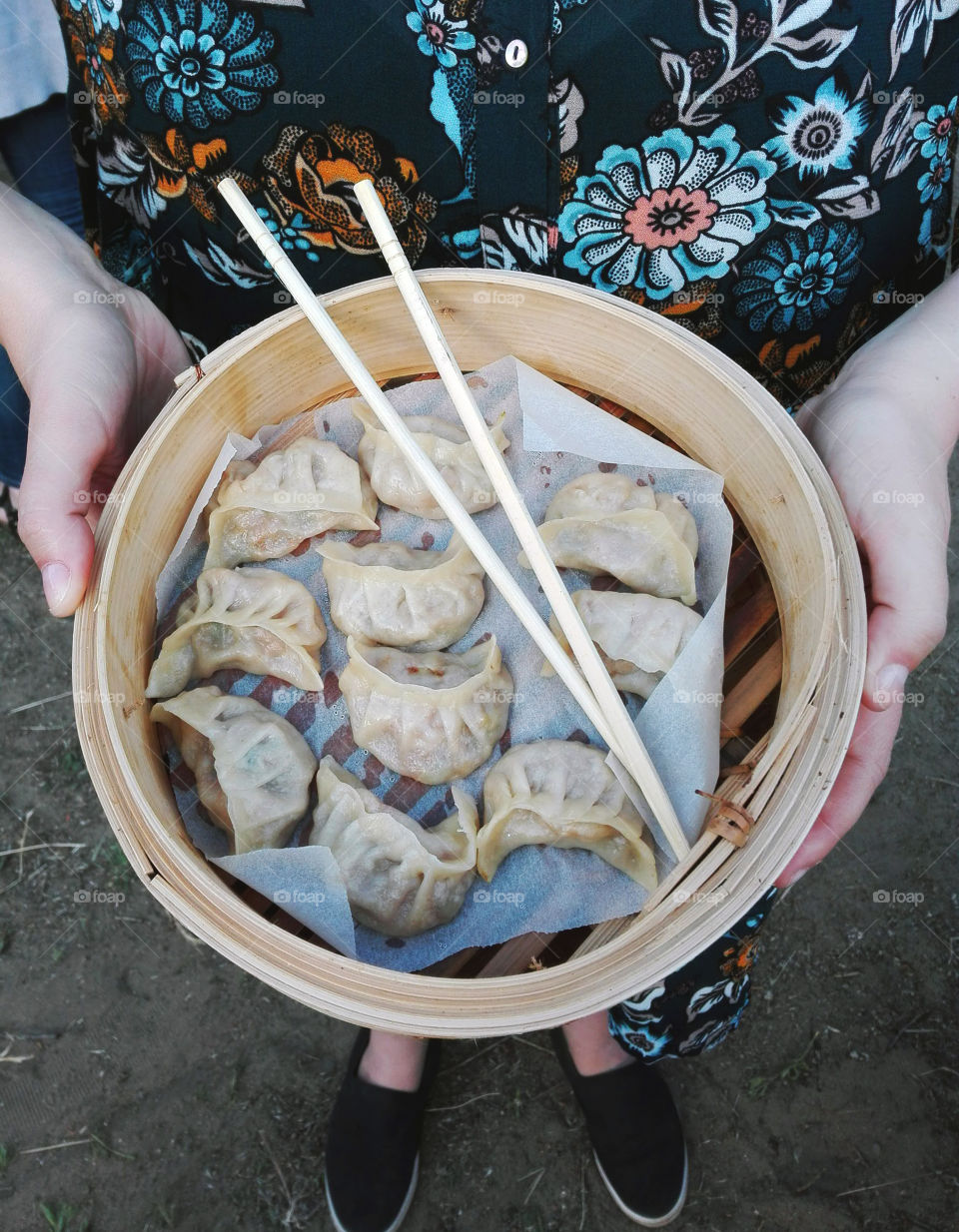 Women holding dumpling