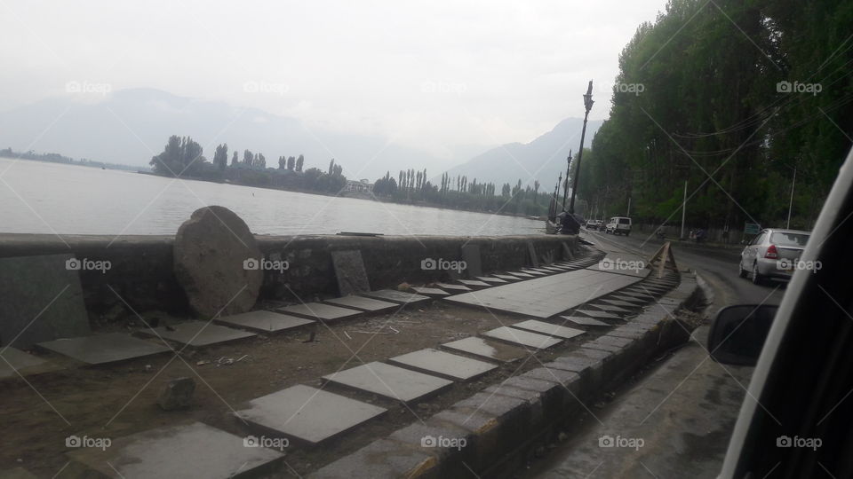 Off shoar Road called Bouli Ward Road encircling Dal Lake Srinagar.