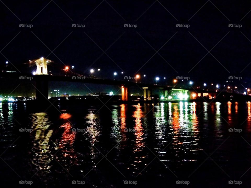 Bridge architecture and design with colorful lightings stunning at night photo.