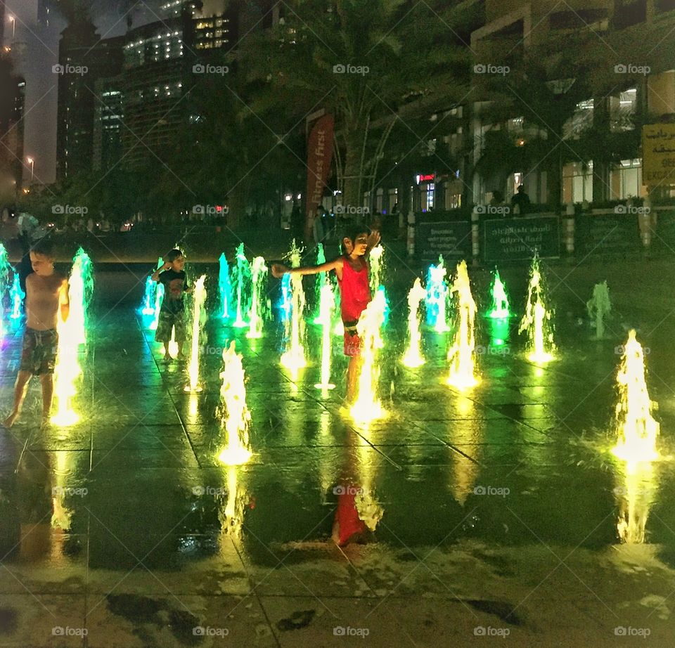 Children enjoying the color fountain