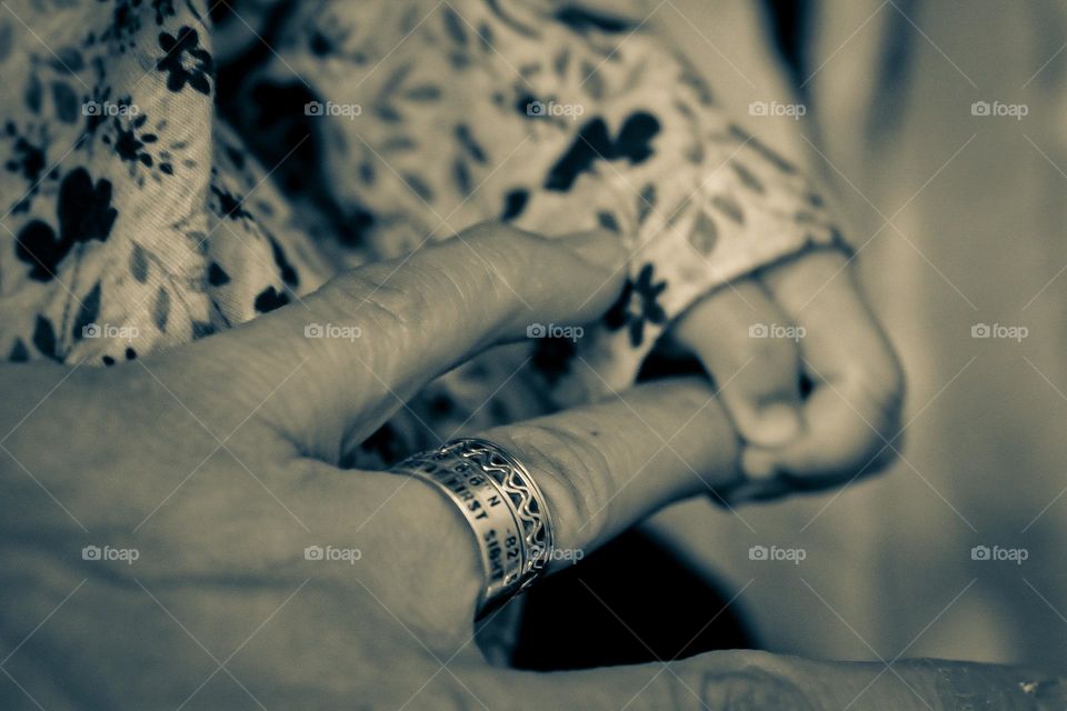 Tender moments with baby daughter, baby girl holds mother’s hand, baby’s hand grasps mother’s hand, black and white photo of mother and baby
