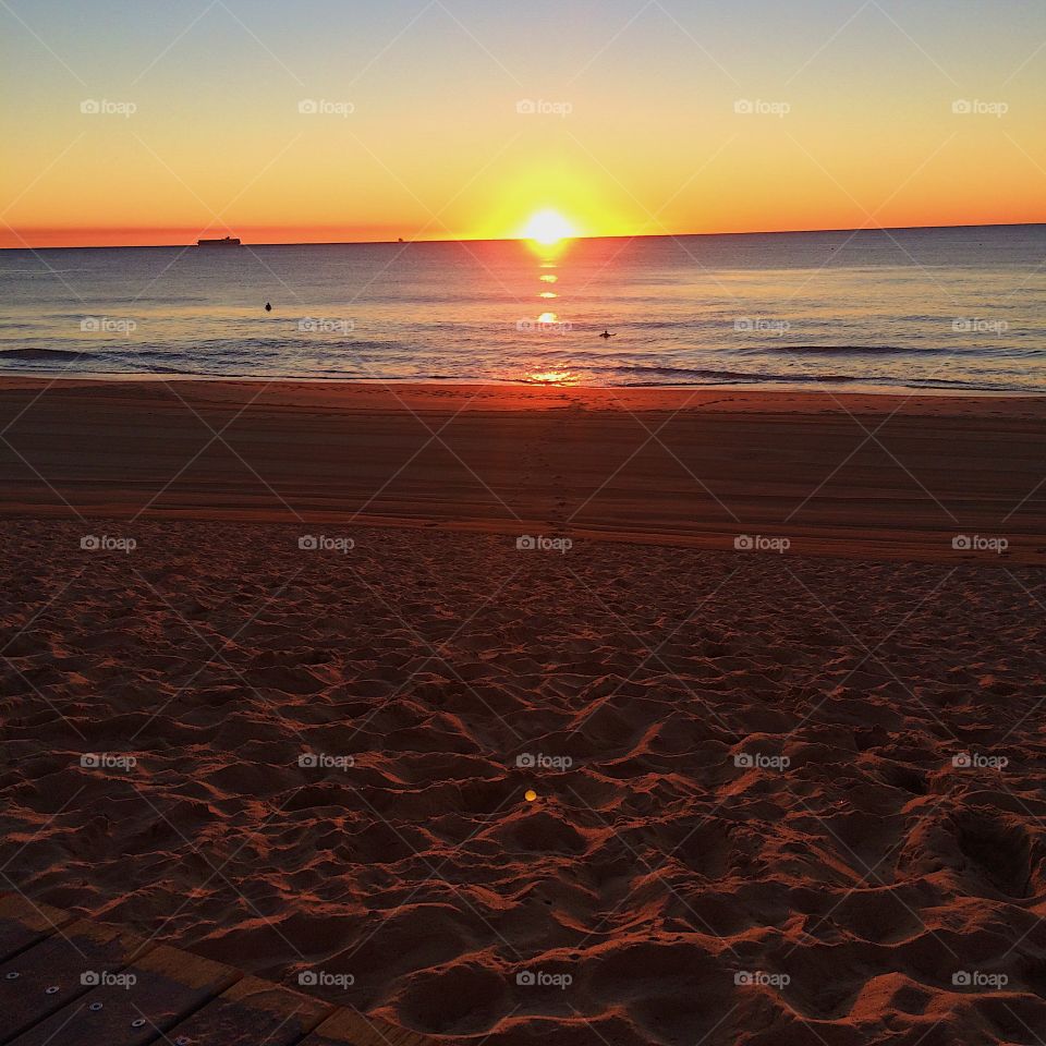 Golden beach sunrise over the ocean 