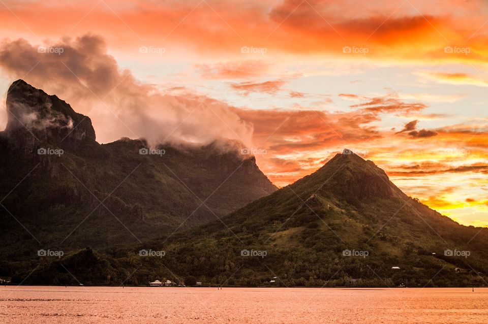 Clouds drifting across the mountains in Bora Bora