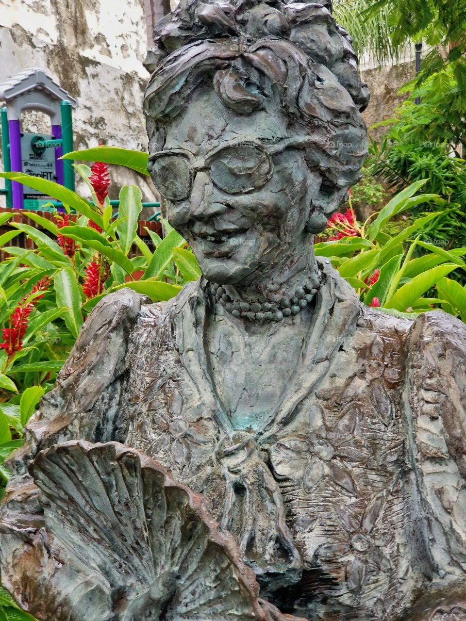 Statue looking over botanical garden..