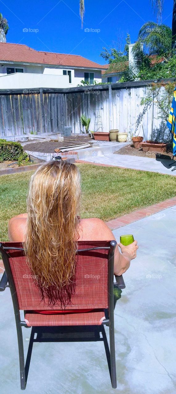my beautiful sister out in the back drinking our wine and join the sun on this beautiful day