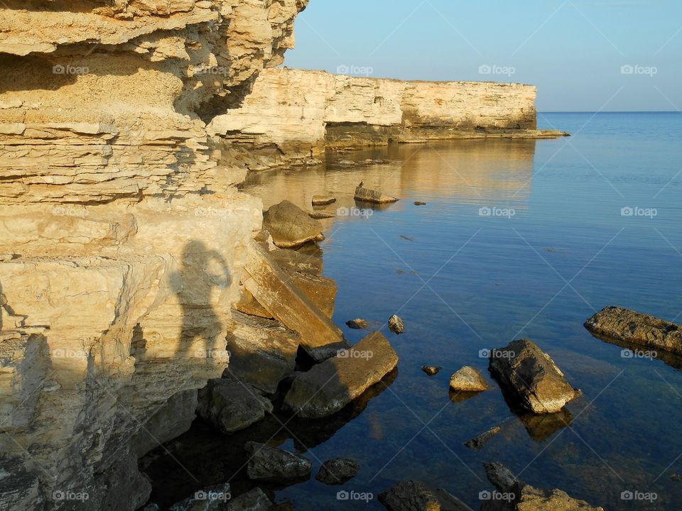 shadows girl on stone sea rock beautiful summer seascape, travel vacation