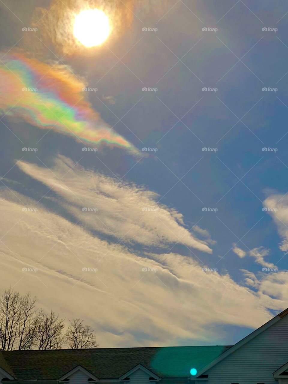 Driving home last week, I snapped a pic of the sky with my iPhone out the window but could not see what it looked like because I was shooting into the sun. I was surprised to see this enchanting rainbow cloud when I viewed the images later.