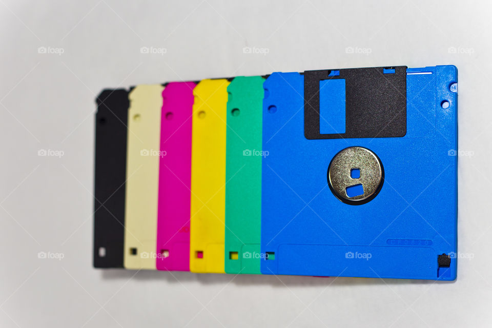 Colorful floppy disc. why outdated technology should be monotone