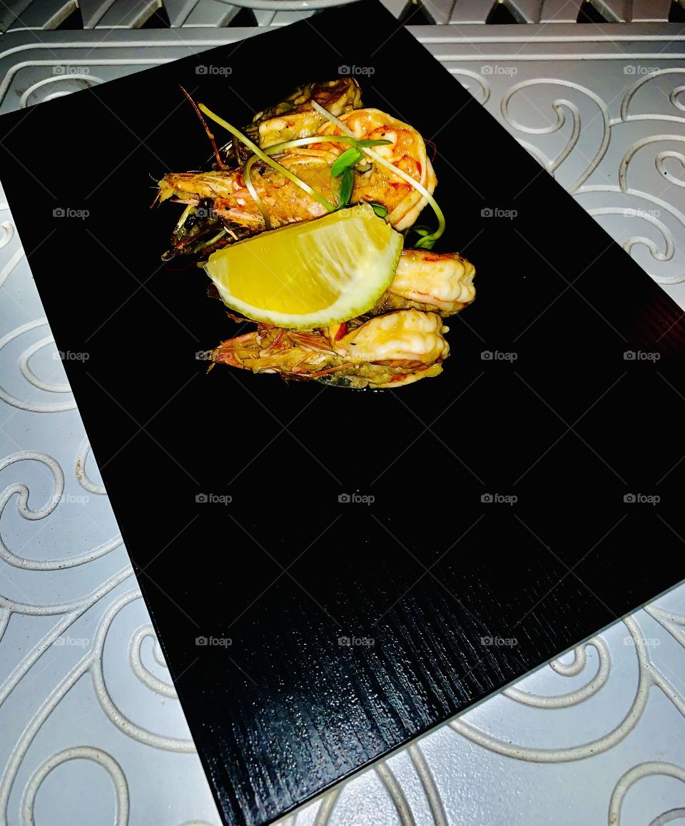 A finger licking good and delicious plate of prawns as a starter