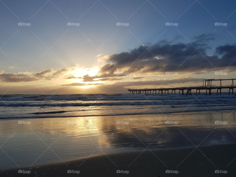 storm clouds over pier