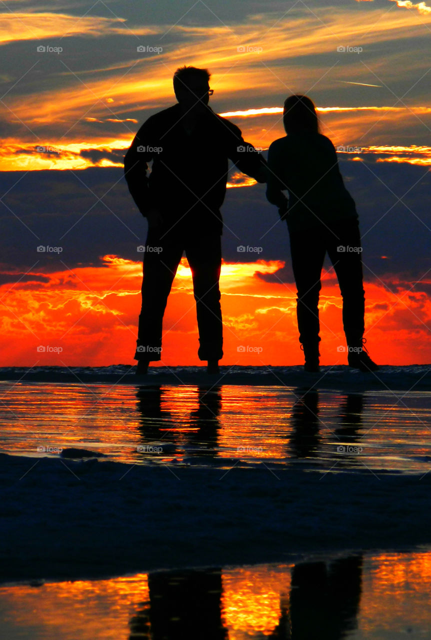 Amazing Silhouettes! Like the meeting of two worlds - the known and the unknown. The sun is like a great big romantic, inspirational fire in the sky. Brilliant streaks of yellow, orange, gold, blue, pink and red overcome the blue and purple of the sky. The sky resembled a prism; all the colors blended perfectly together. It's as if the colors and intensity of the light is just right! My work is done for today. I'm not sure what tomorrow will bring, but I'll be prepared for it!