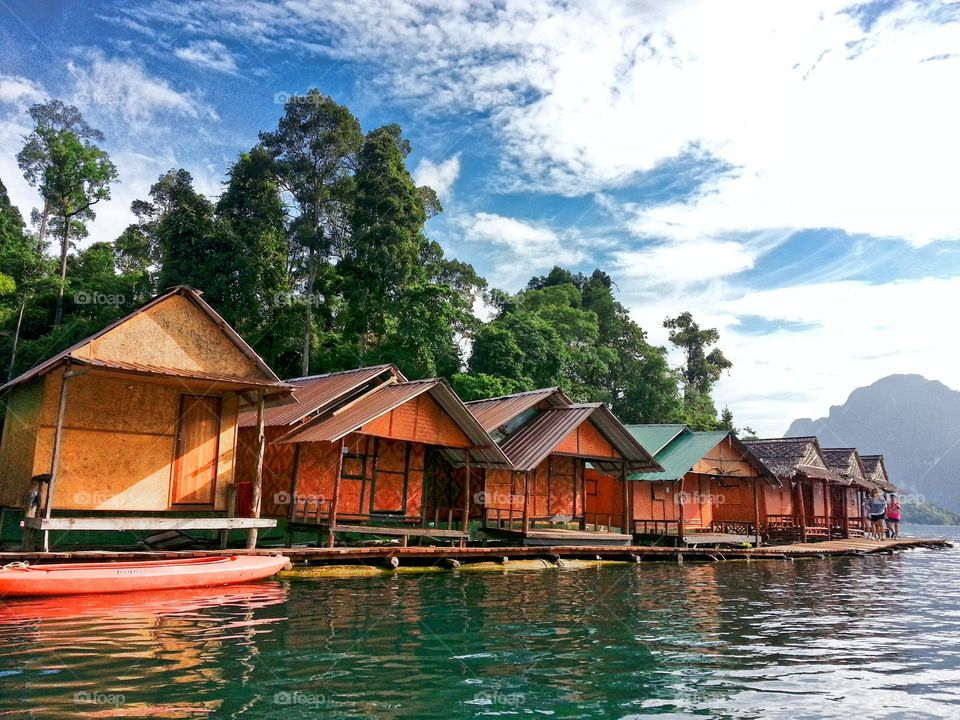 small bamboo huts floating on the water