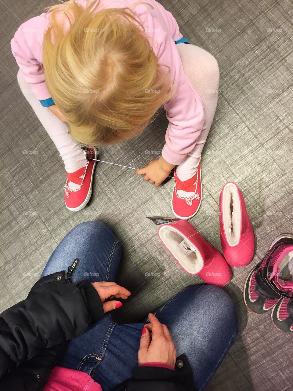 Testing shoes with kids in shoestore.