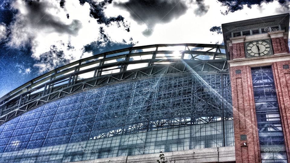 Architecture. Sunshine & Clouds Passing Through Retractable Roof