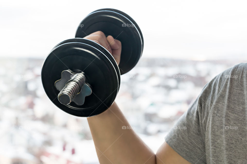 man with dumbbells doing exercises