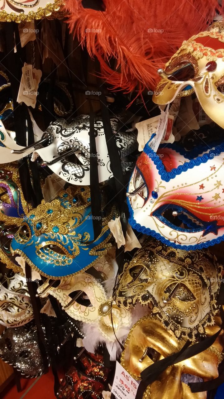 Masquerade masks. a nice collection of masks in a store display...
