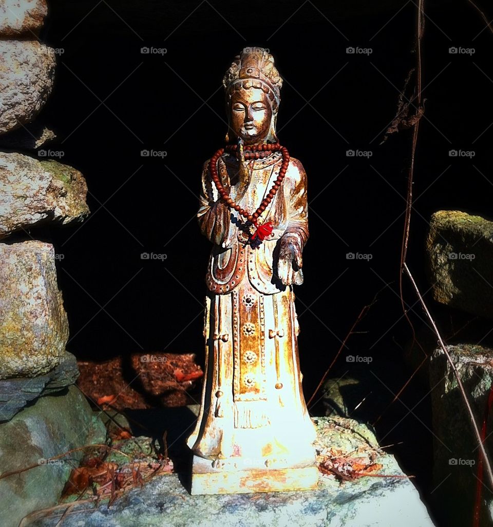 Buddha statue in a cave 