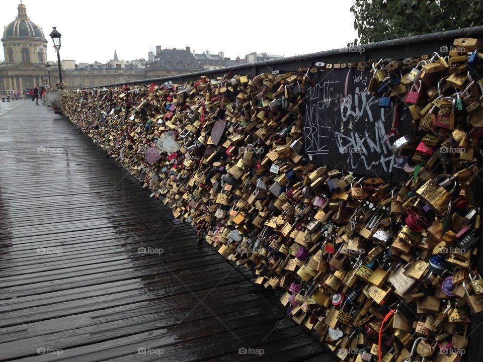Paris. My husband and I got engaged in Paris... We placed a lock on the bridge and I snapped this photo shortly after. 