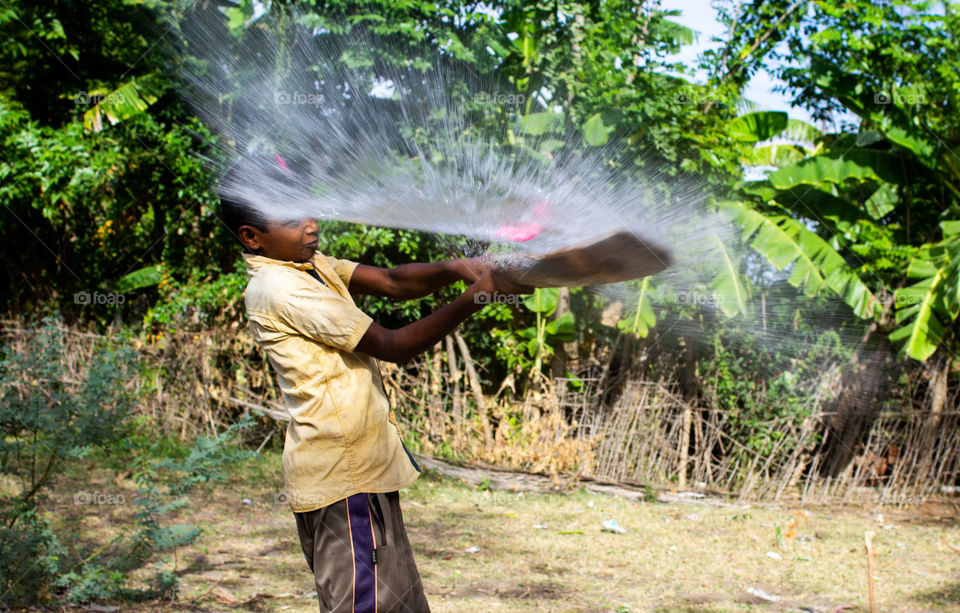 A story of a street boy playing baloon battle to beat the heat  #summer