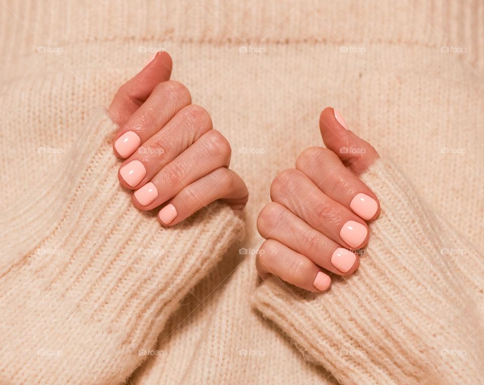 hands with pink manicures