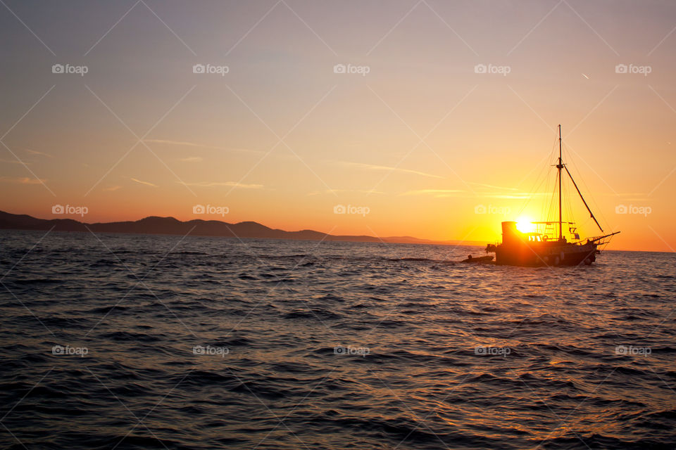 Boat sailing during sunset