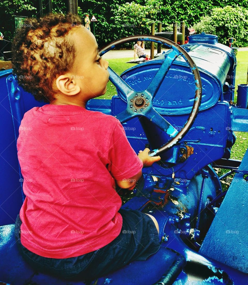 Boy on tractor