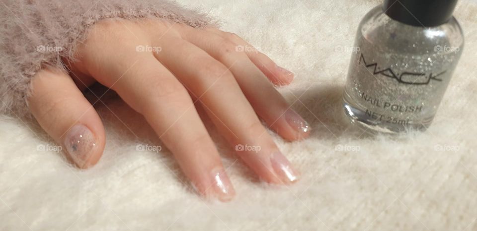 maintenance of your nails, with specific care, with a beautiful shine that highlights the beauty of your hands.  glitter nail polish