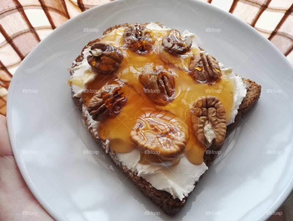 whole wheat toast bread, cream cheese, honey and walnuts for breakfest