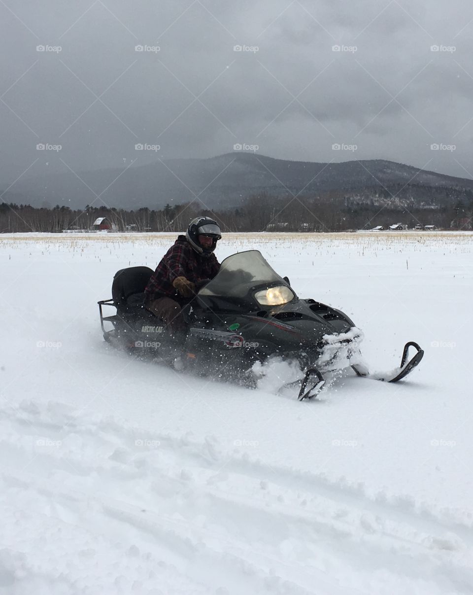 Snowmobiling in fresh March snow