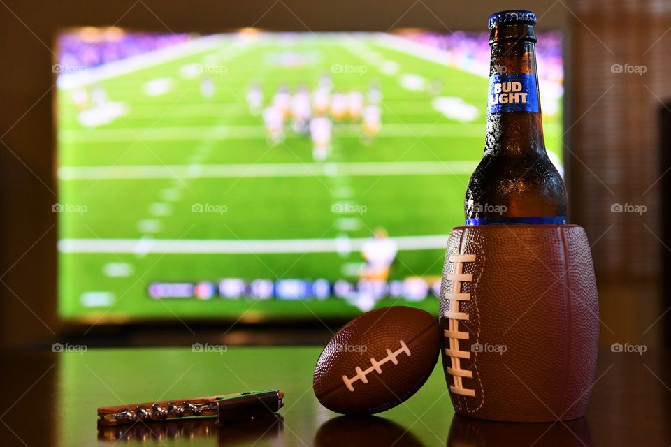 Watching football with cold beer