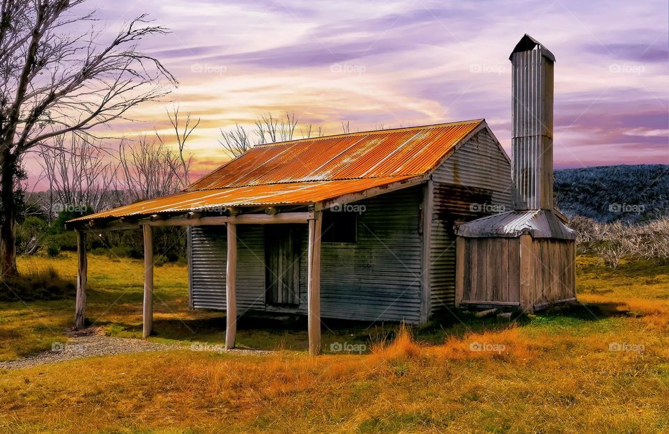 Cottage At Sunset