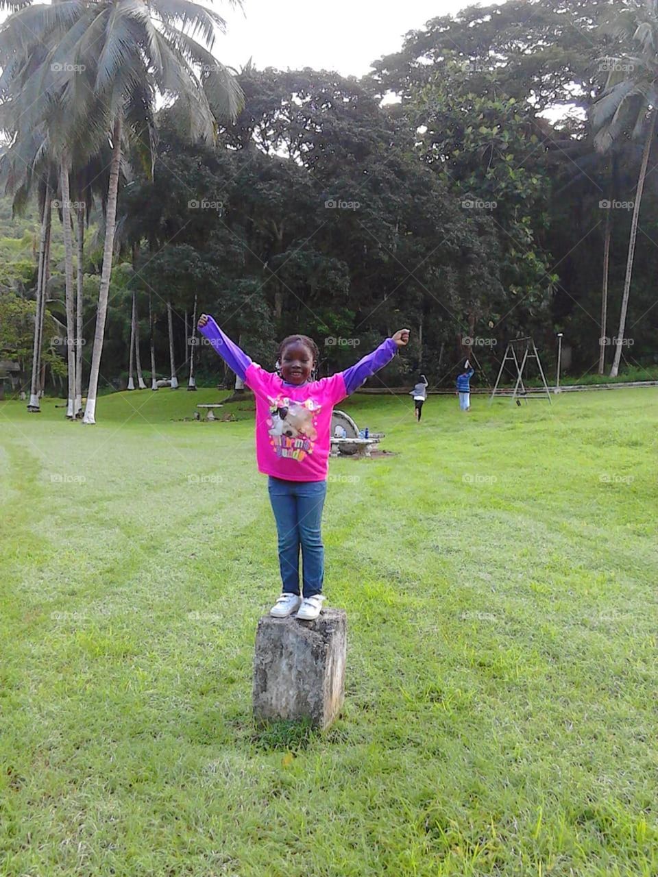 She's on top of the world, confident and free.