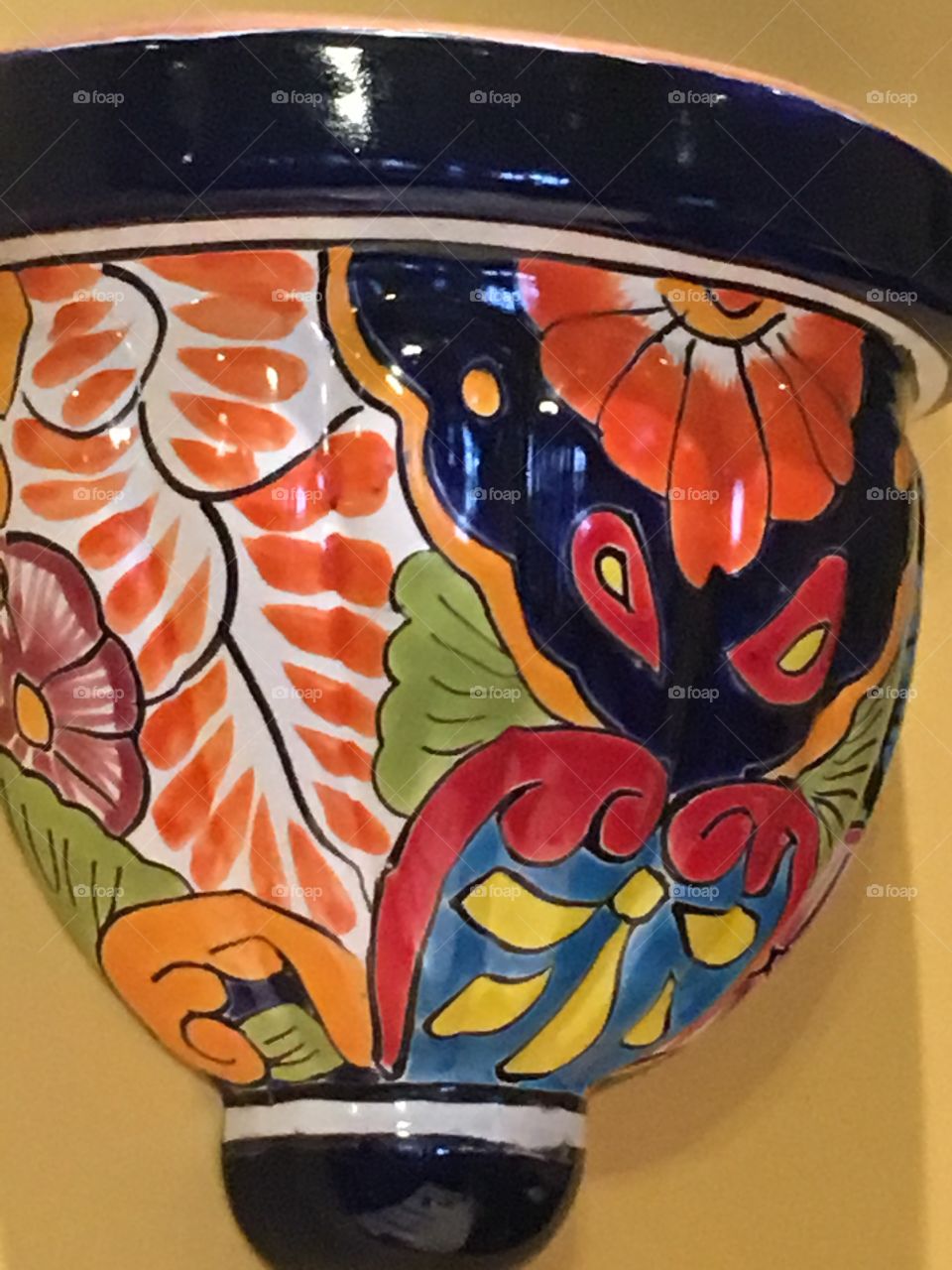 Add some spice to your wall with these colors! A half moon ceramic vase decoration.