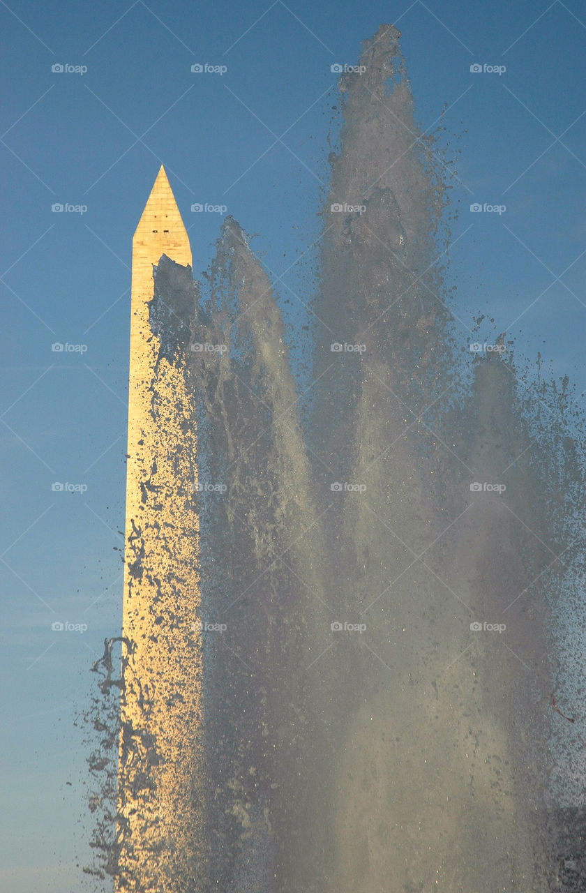 The Washington Memorial seen through a fountain at the World War II