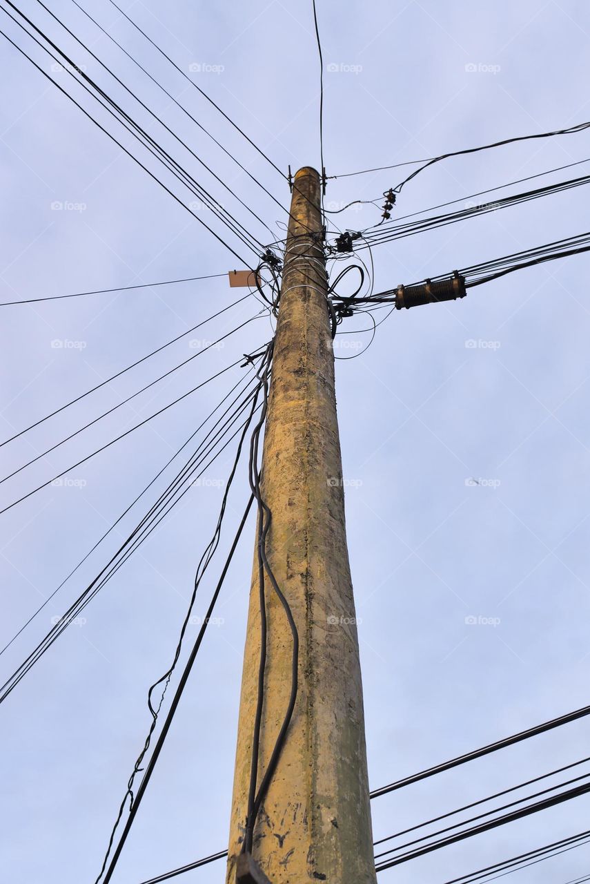 Street lighting pole with electric cables