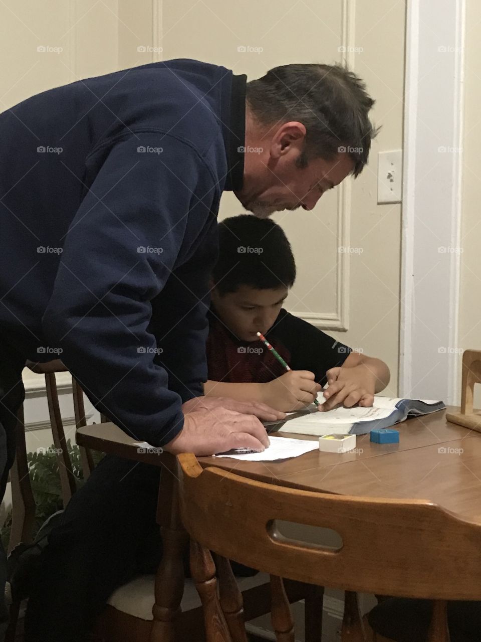 My husband helping my son doing homework, someone he trusts