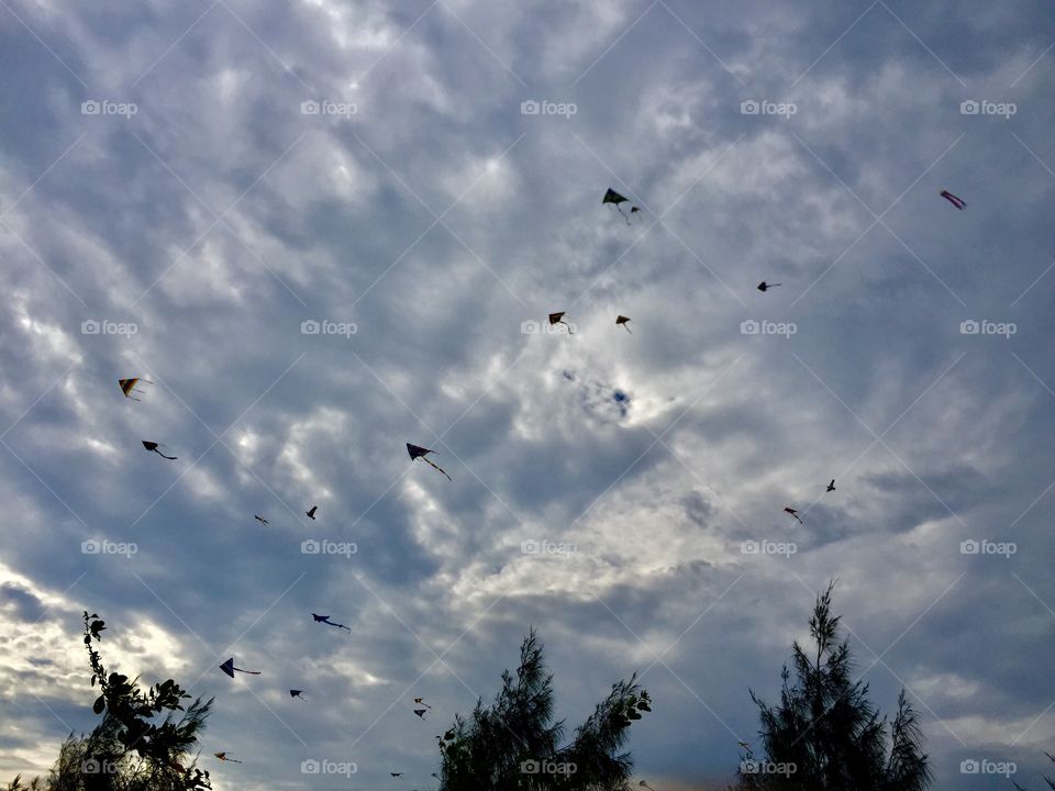 Kids play kite at Sekinchan beach