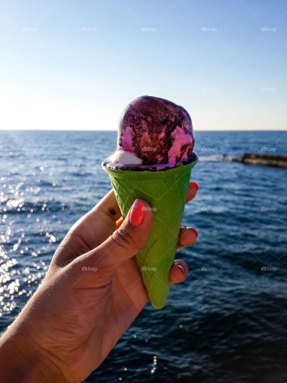 Human hand holding ice cream