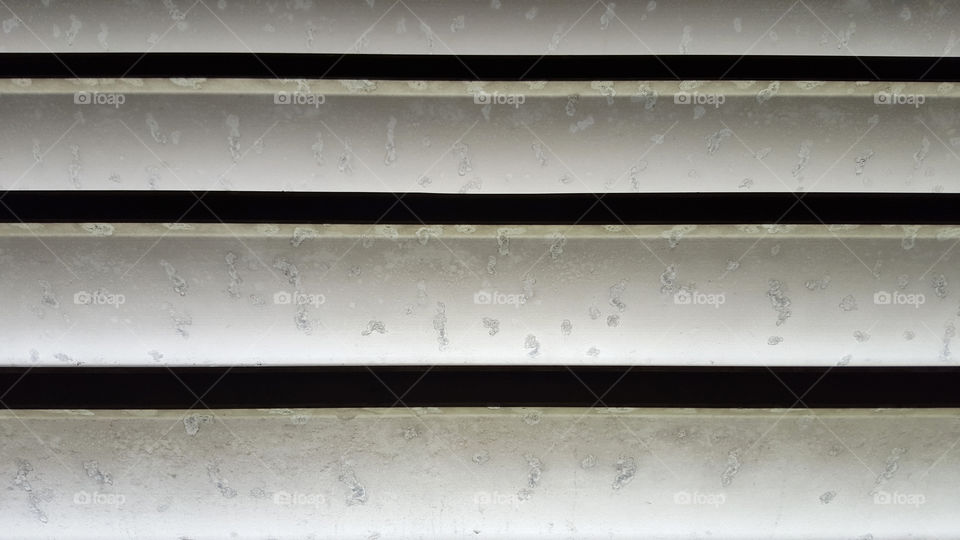 Old white fence with dirt 