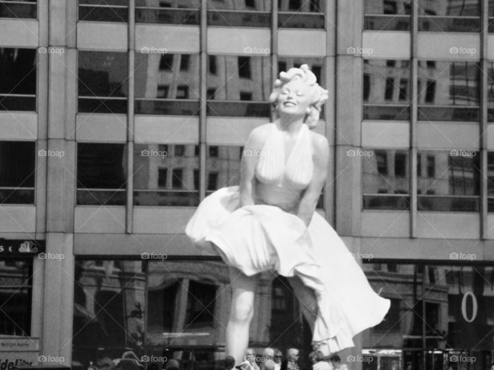 Iconic Marilyn statue . Photo taken in Chicago.  Iconic statue in front of building.